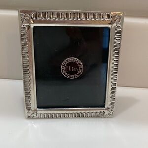 NWT Sophisticated Elias extra fine pewter with silver frame. No need to polish!